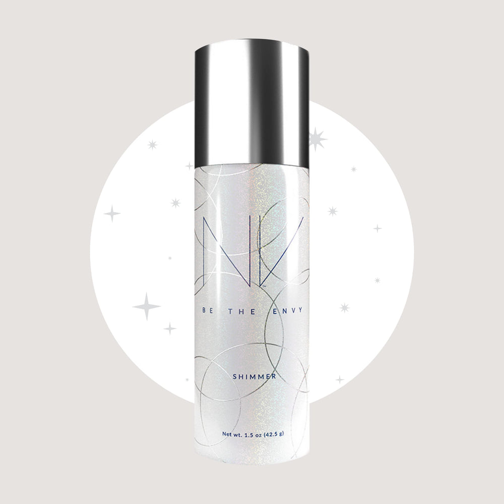 BE THE ENVY NV Perfecting Mist Shimmer glow on cheekbones highlights a moonlit sparkle.