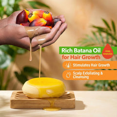 Beauté Seoul Batana Oil Shampoo Bar in hand showing compact, travel-friendly hair care.