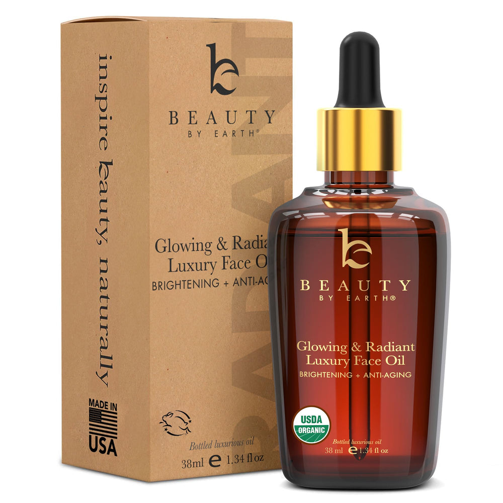 Beauty by Earth face oil bottle with organic formula for deep hydration.