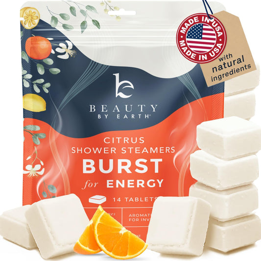 Beauty by Earth citrus shower steamer tablet releasing a bright, energizing aroma.