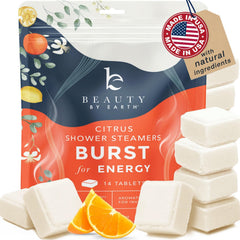 Beauty by Earth citrus shower steamer tablet releasing a bright, energizing aroma.