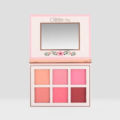 Beauty Creations Floral Bloom compact beside fresh florals and sunlight.