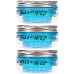Hands applying Bed Head Manipulator for controlled styling