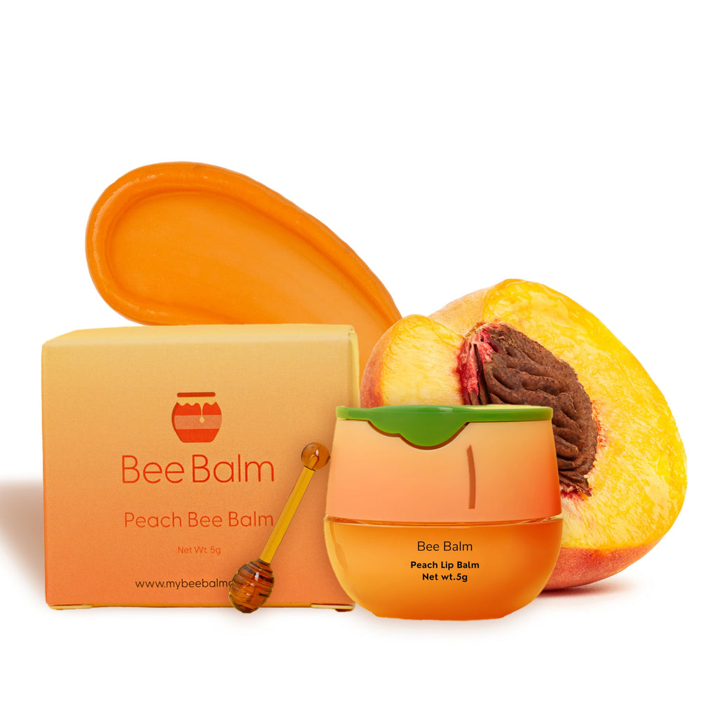 Bee Balm Original lip balm peach honey pot on display for hydration.