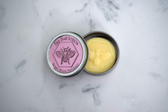 Bee Bar Honey House Naturals Duo Lavender open tin reveals creamy balm texture for hands.