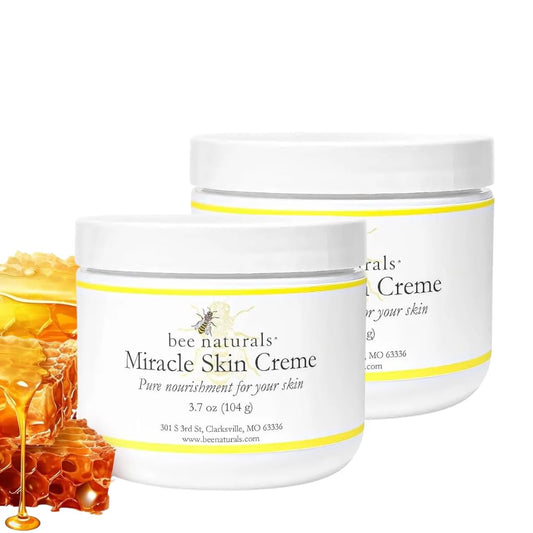Bee Naturals Miracle Skin Creme jar application highlights rich hydration for face and body.