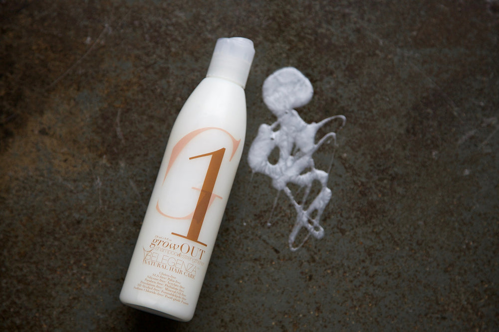 Belegenza GrowOut Shampoo Strengthener bottle with foam conveys luxurious lather and fragrance