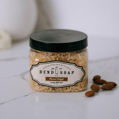 Bend Soap Company Almond Delight Milk Bath bottle pouring for a soothing soak.