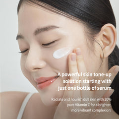 BENTON Vitamin C Serum application close-up shows silky texture and quick absorption.