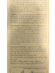 BENTON Vitamin C Serum bottle on a nightstand with soft lighting for evening use.