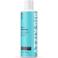 Big Kizzy F.A.T.T. thickening shampoo bottle label visible, ideal for extensions and fine hair.