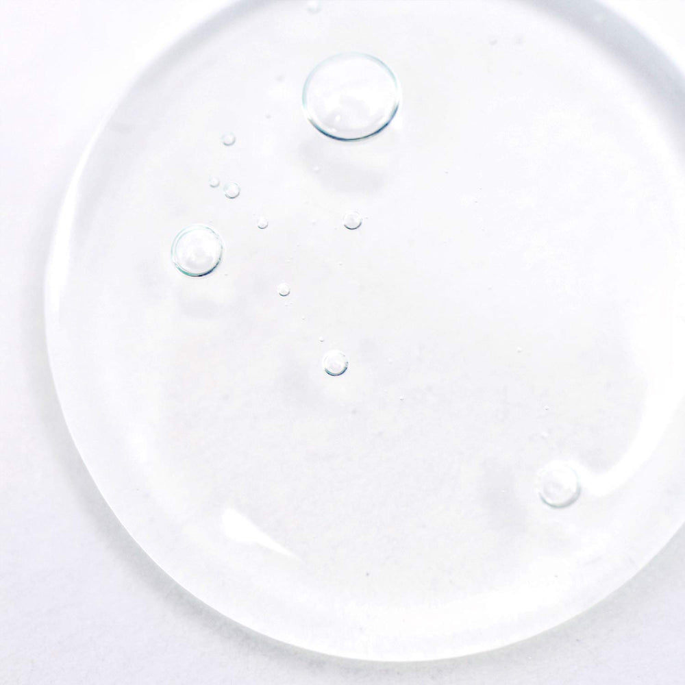 BioClarity bottle shows botanical trio: chamomile, green tea, cucumber for skin balance.