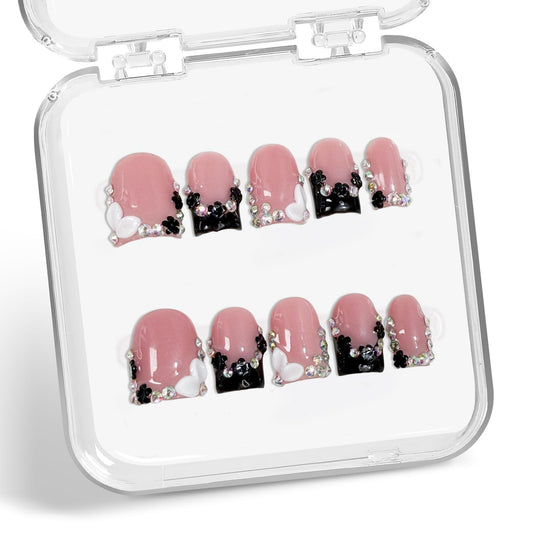 Black French Tip press-on nails with 3D flowers and rhinestones for elegant everyday wear.