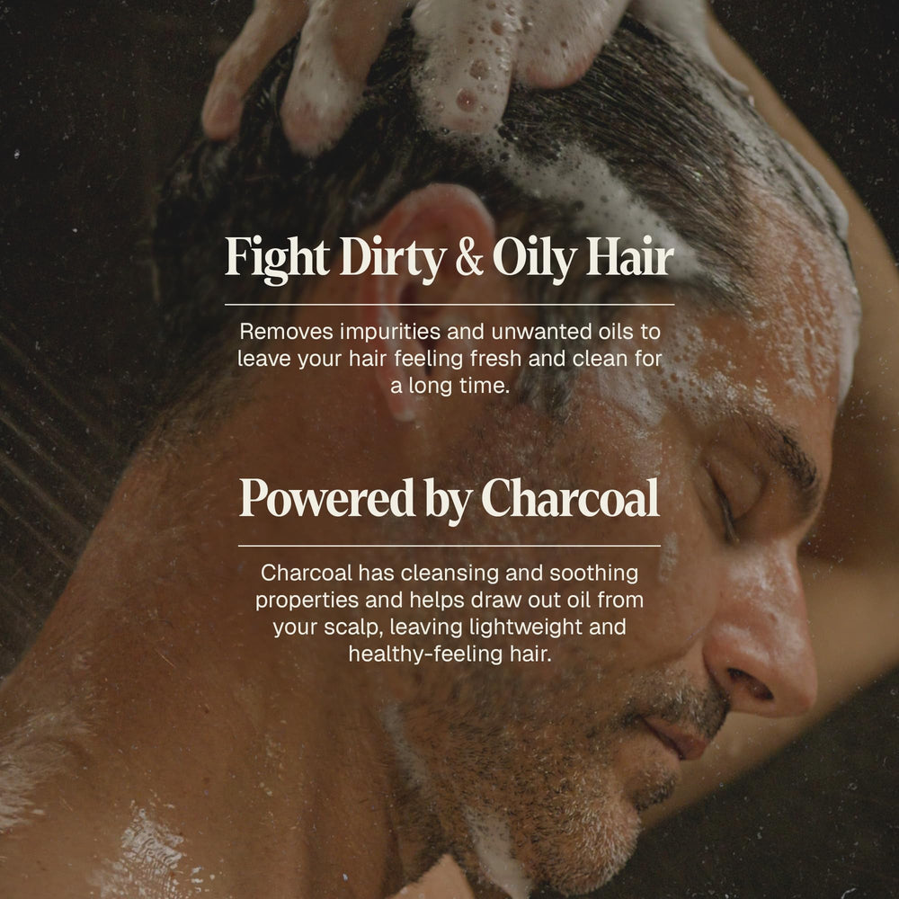 Black Wolf charcoal-infused shampoo on wet hair for a deep clean