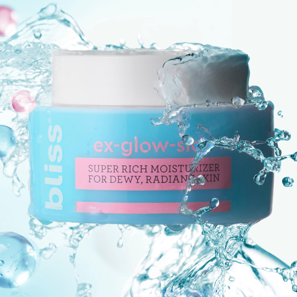 Bliss Ex-glow-sion model applying moisturizer for dewy glow.