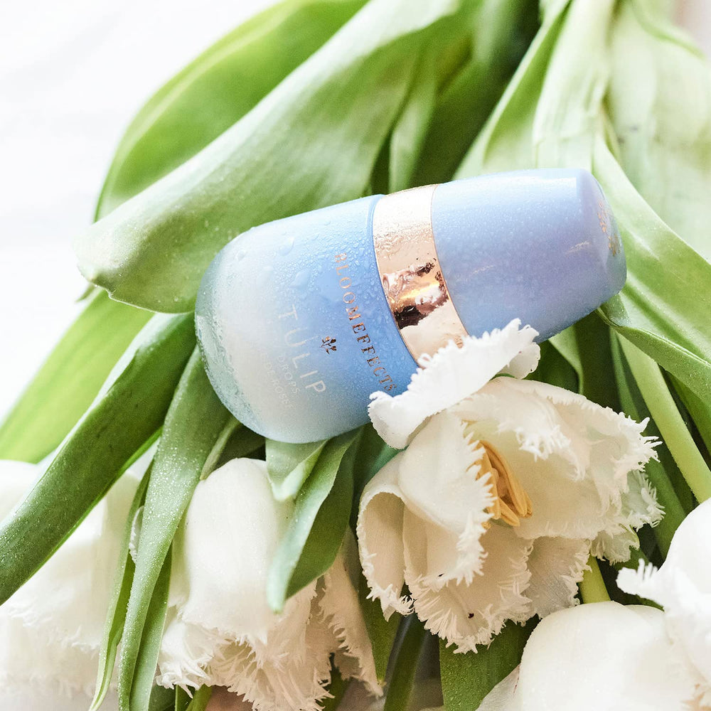 Bloomeffects Tulip Dew Drops front bottle with soft lighting emphasizes premium ingredients