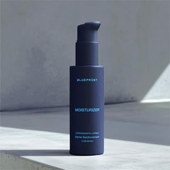 Closeup of Blueprint Bryan Johnson Moisturizer bottle label highlighting SFC and NMN benefits.
