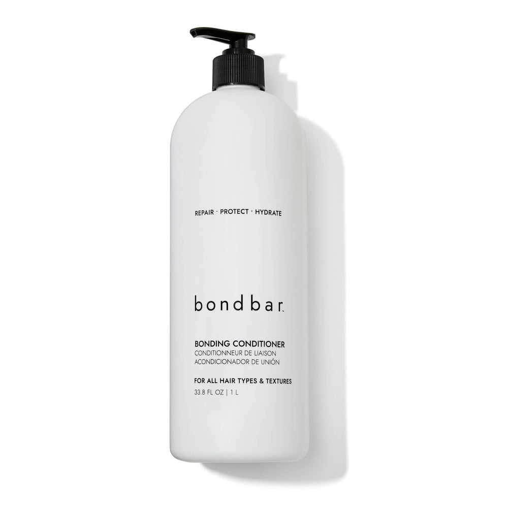 Bondbar conditioner bottle being poured for damaged hair care and repair