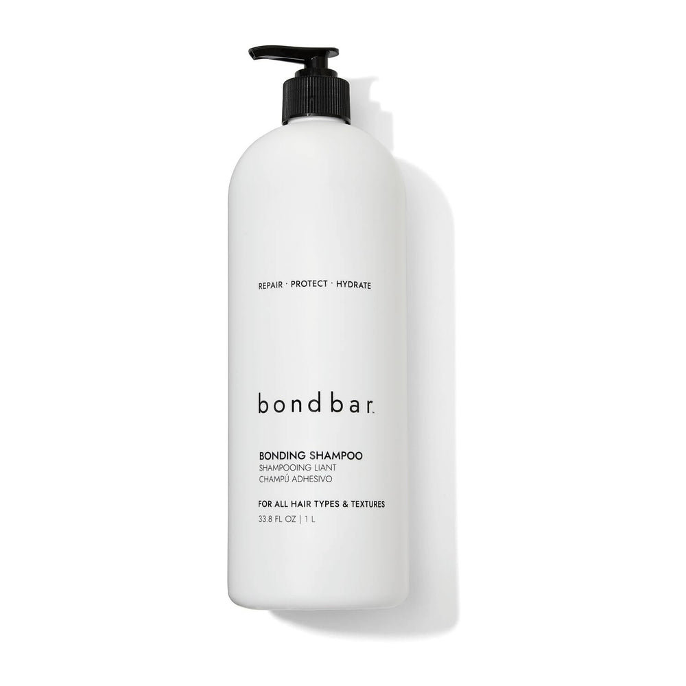 Bondbar Repairing Shampoo bottle pour demonstrates hydration for all hair types.