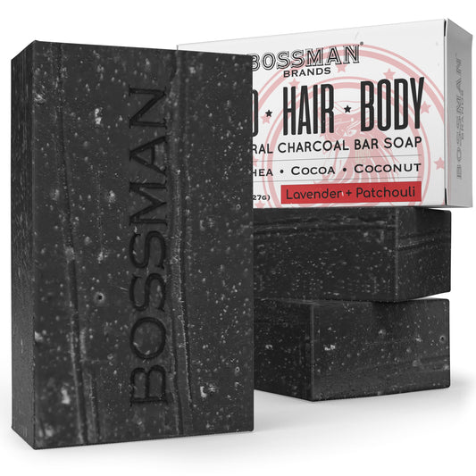Bossman 4-in-1 charcoal soap bar on wood, ideal for beard, hair, and skin care