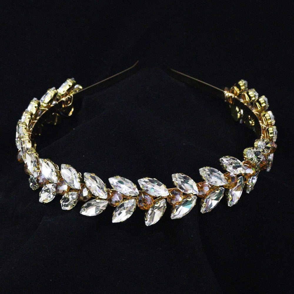 Brihasory green rhinestone headband closeup shows crystal facets.