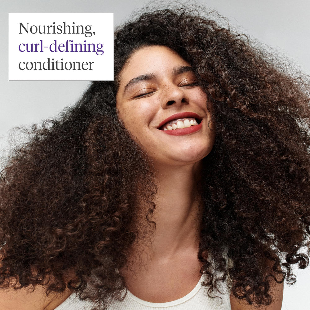 Briogeo Curl Charisma frizz-suppress image suggests humidity resistance for lasting style.