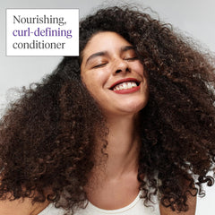 Briogeo Curl Charisma frizz-suppress image suggests humidity resistance for lasting style.