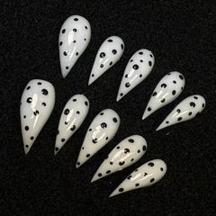 BRKYKGK medium stiletto eagle claw nails with black and white polka dots for quick glam