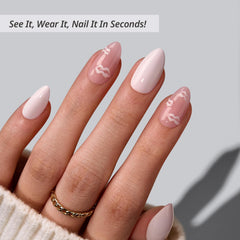 BTArtbox Dainty Kiss nails on hand show natural almond shape for everyday wear.