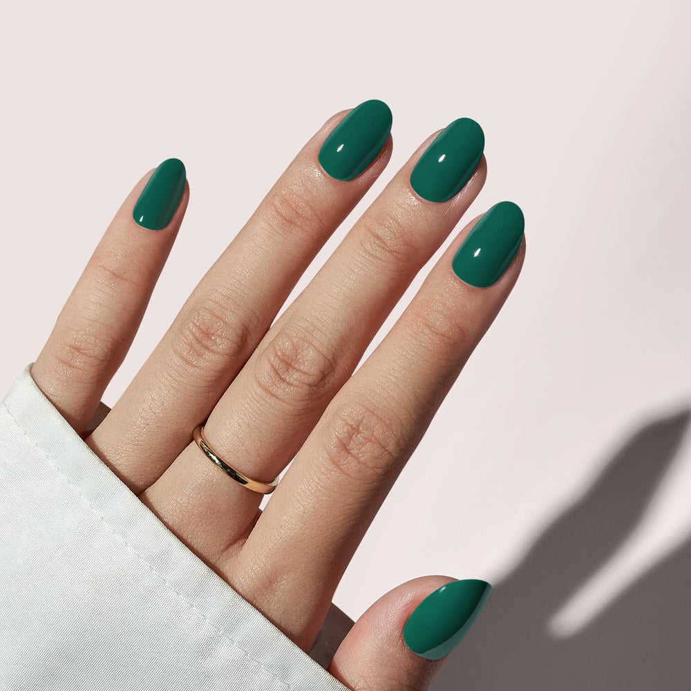 BTArtbox dark green short oval nails close-up showing a glossy salon-style finish
