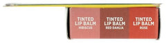 Applying Burt's Bees lip balm from the holiday minis set on lips for smooth care.