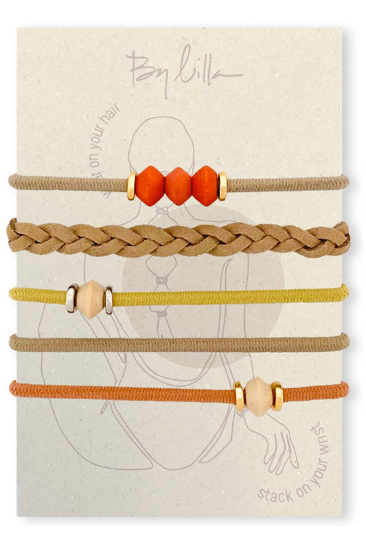 By Lilla bracelet hair tie limestone on the wrist for secure, damage-free wear