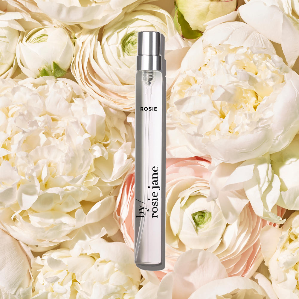 By Rosie Jane Rosie travel perfume bottle close-up with rose detail.