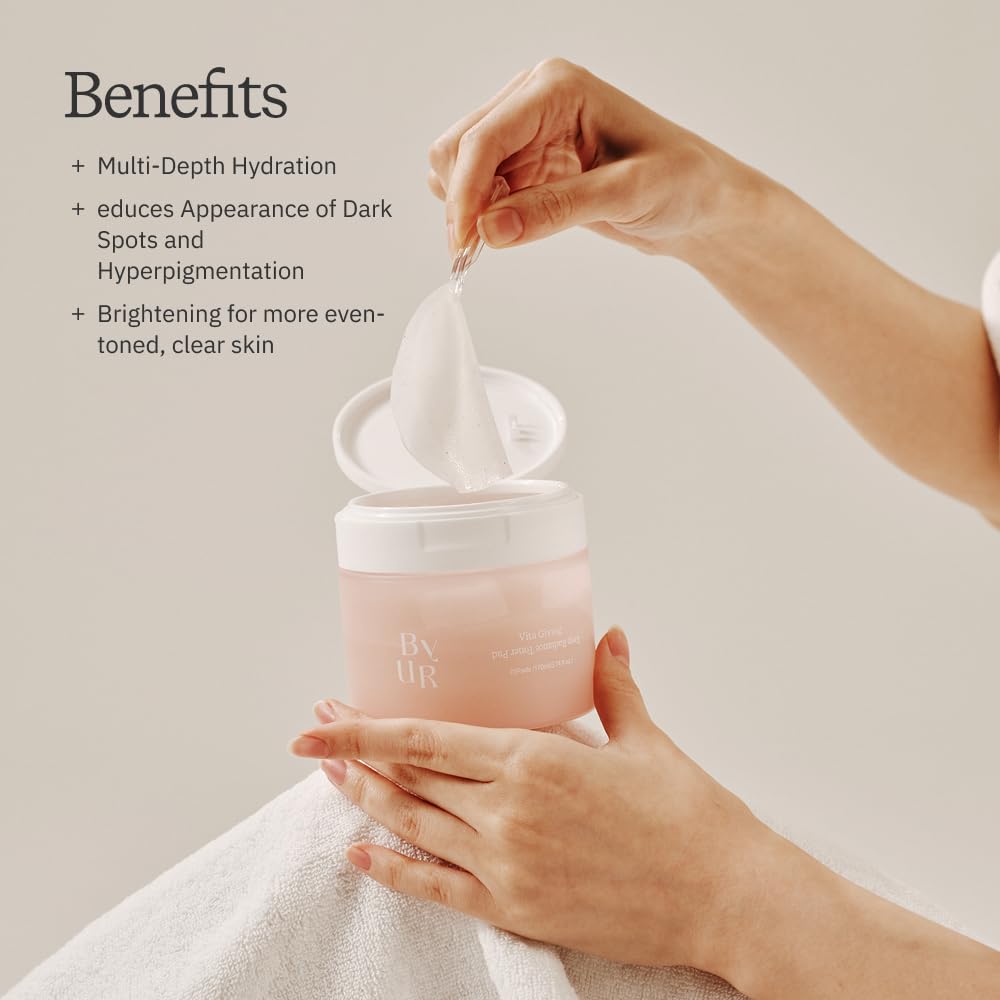 ByUR Vita Giving Keep Radiance toner pad swiped across skin to prep routine.