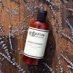 C.O. Bigelow Lavender Peppermint Conditioner being poured for quick, soothing detangling
