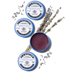 C.O. Bigelow Lavender Salve tins aiding dry elbows and knees during dryness.