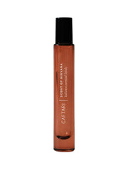 Caftari Oudh Cedarwood Patchouli roll-on close-up for long-lasting fragrance.