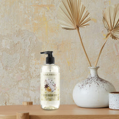 Caldrea Gilded Balsam Birch by sink ideal for hand washing delicate fabrics.