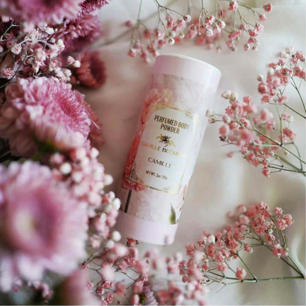 Camille Beckman talc-free powder being gently applied to dry areas.