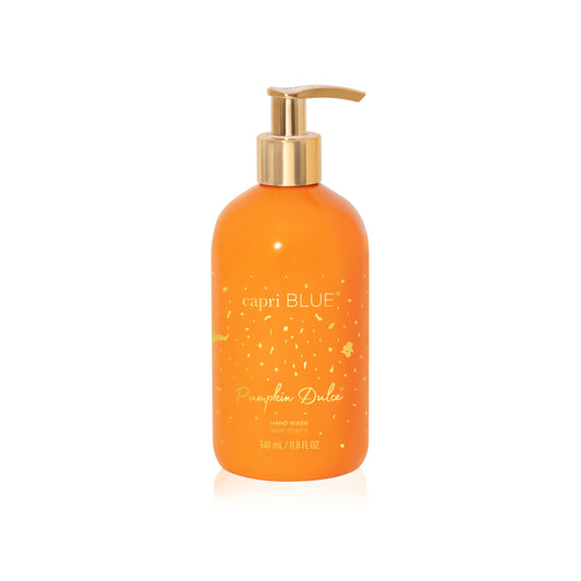 Capri Blue Pumpkin Dulce bottle with pump on counter, showcasing luxe design.