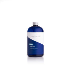 Capri Blue Volcano hand-wash bottle on sink, moisturizing formula highlighted.