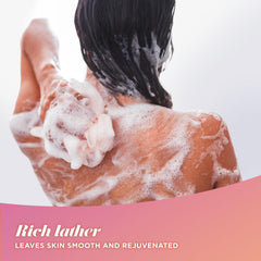 Caress Mango aroma in a shower scene suggesting refreshing fragrance and mood lift.