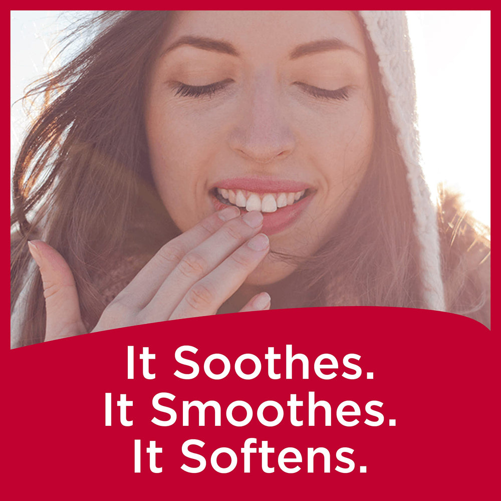 Carmex strawberry lip balm close-up showing a smooth, easy-to-apply texture
