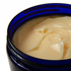 Texture close-up shows shea butter and botanical oils for rich hydration.