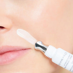 Woman applying CellFiller-XT around the mouth area for smoothing.