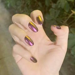 CHARMING MAY Chrome powder with fine glitter creates a luxe manicure glow.