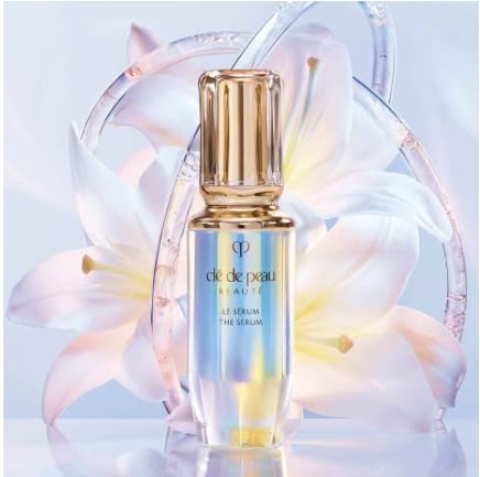 User applying The Serum to face with gentle pressure