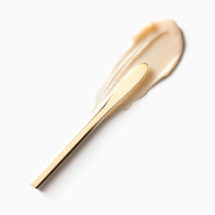 Clé de Peau Beauté mini volumizing cream supreme being applied for a smooth, comfortable finish.