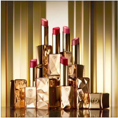 Applying Cle de Peau Shade 1 with a lip brush for precision.