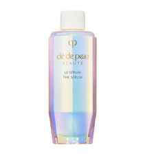 Cle De Peau Serum Refill bottle on vanity showing hydration for radiant skin
